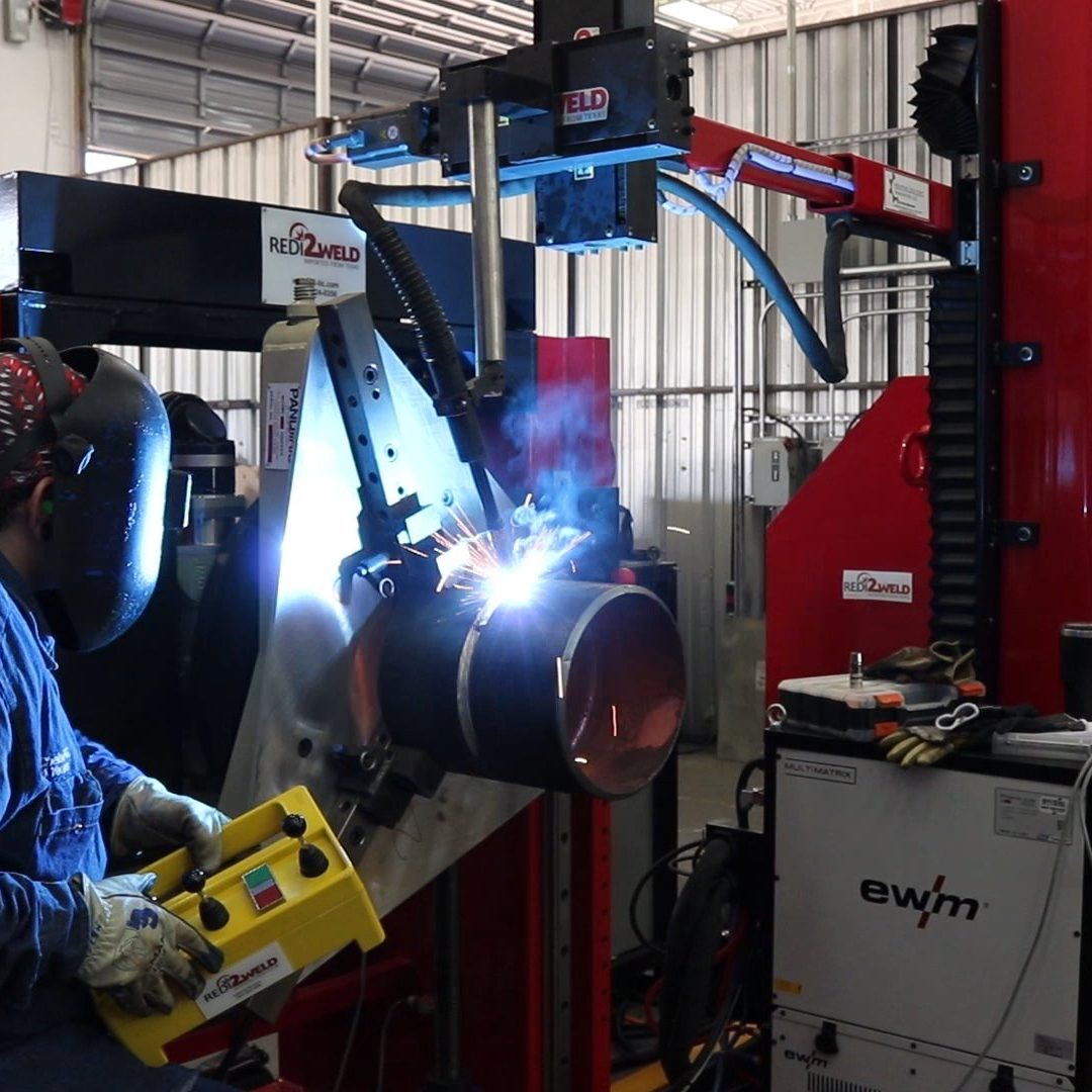 Robotic pipe welding cell in a fabrication shop