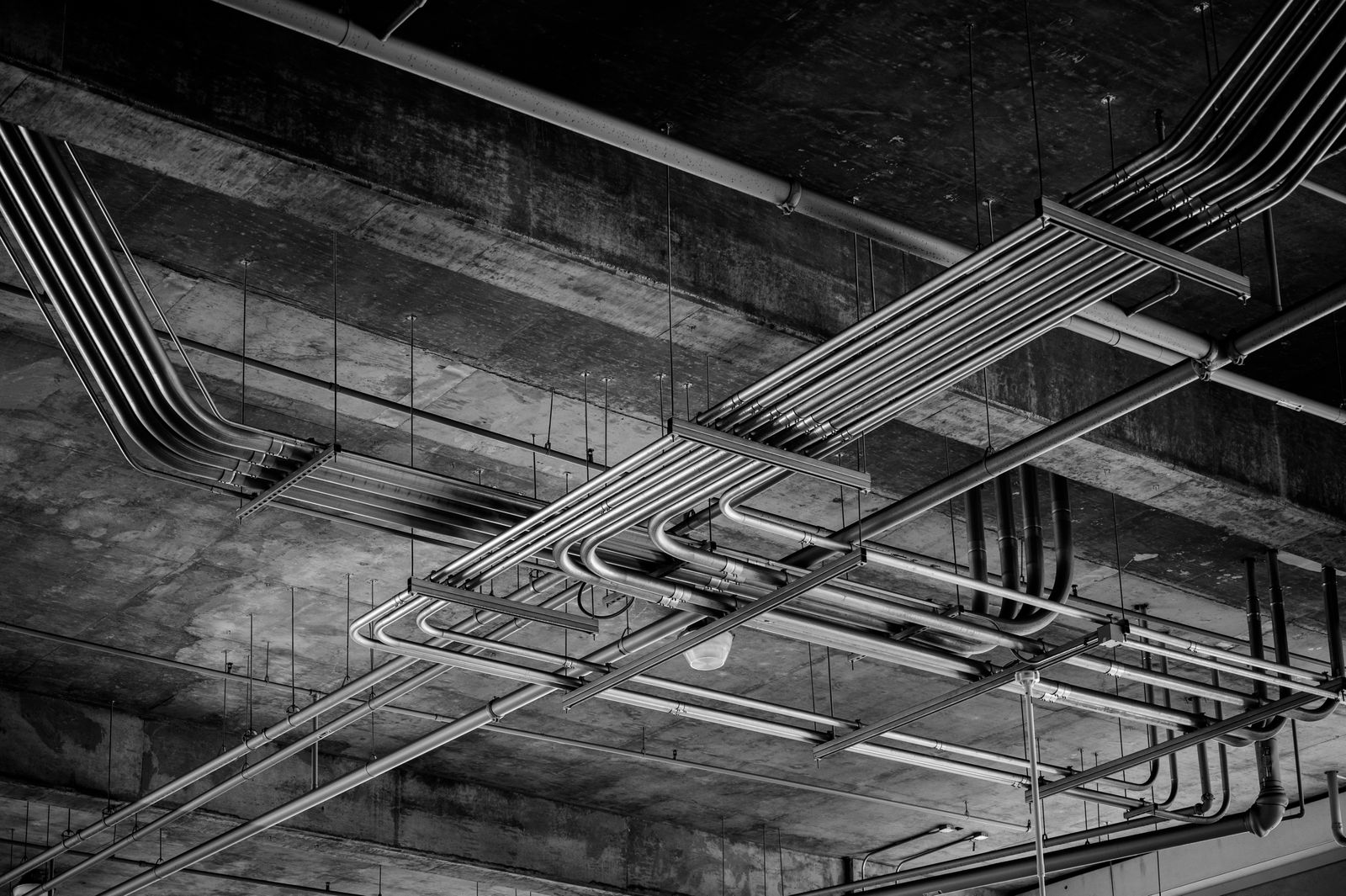 Conduit banks run under a concrete ceiling