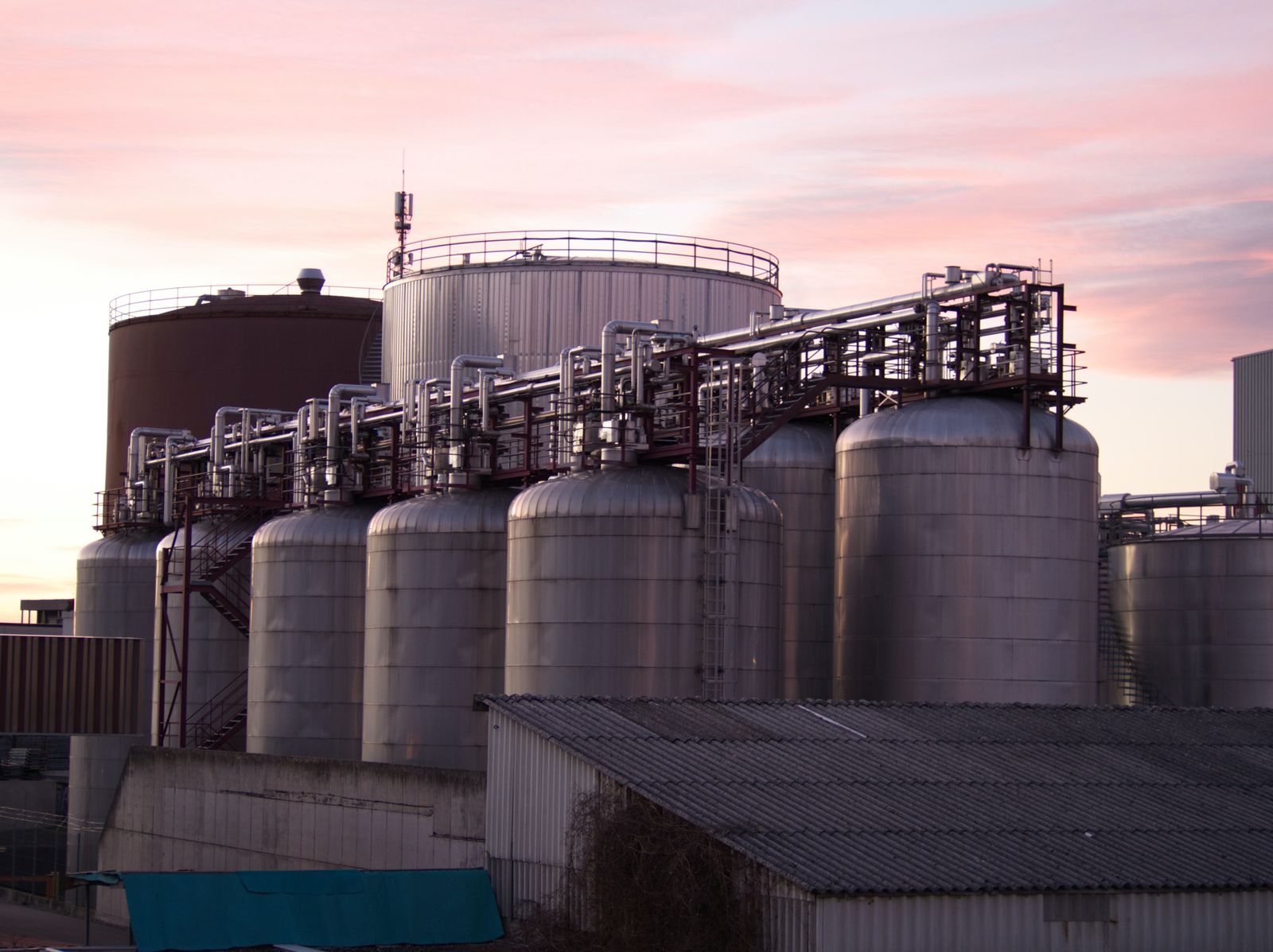 Storage tanks and process piping at an industrial plant