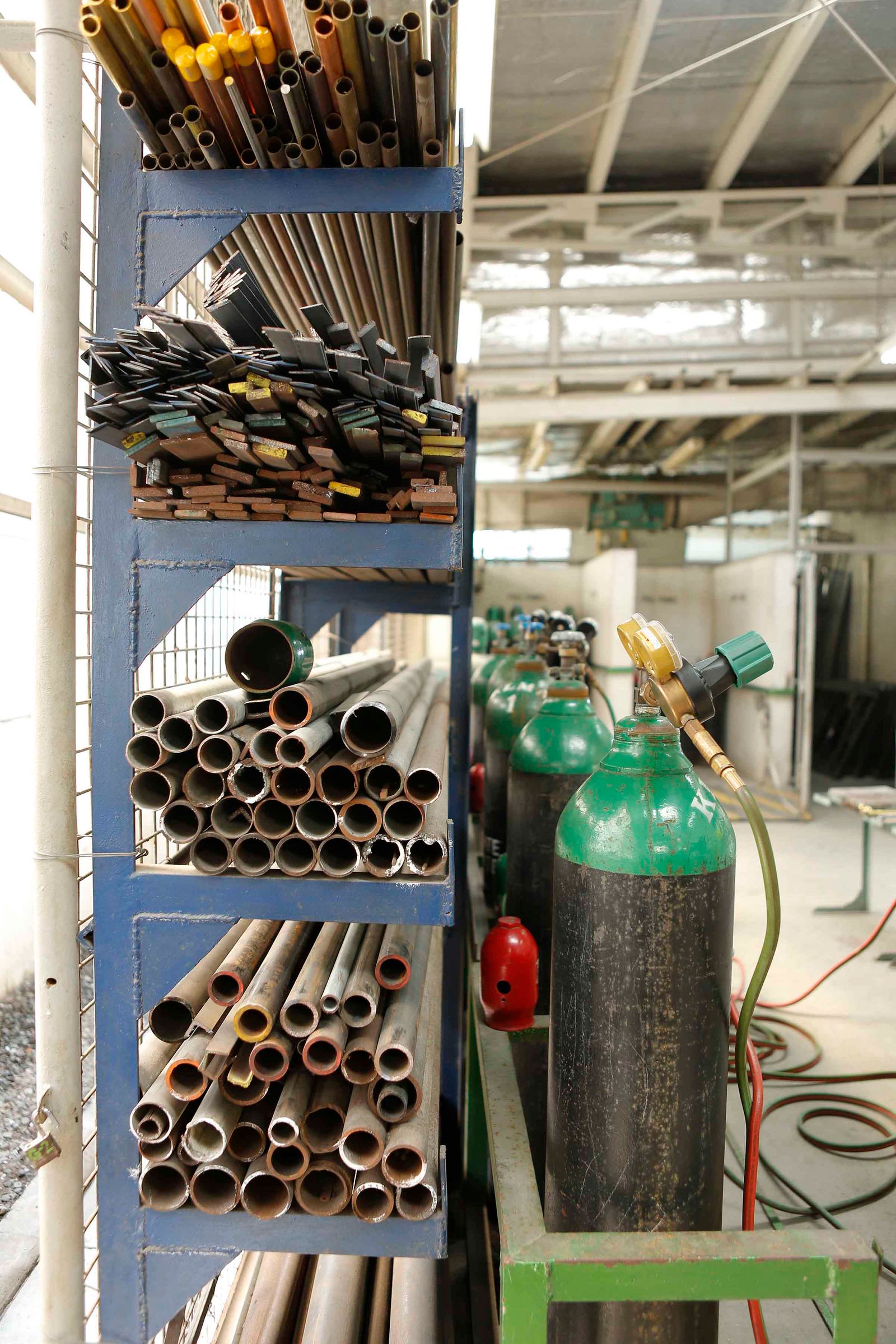 CNC plasma machine cutting large-diameter pipe on a fabrication floor