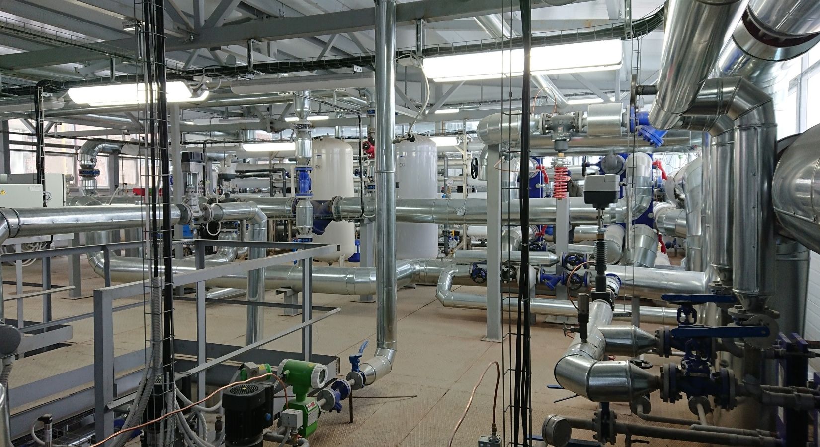 Installed process piping, valves and hangers inside a plant