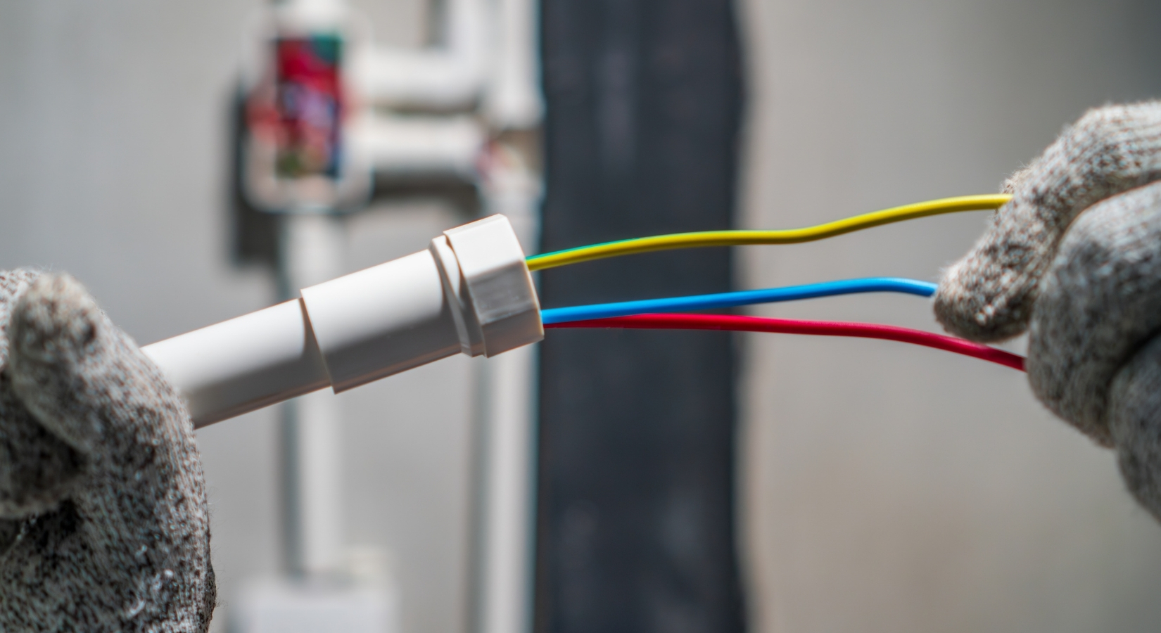 Electricians on a large commercial or industrial job site.