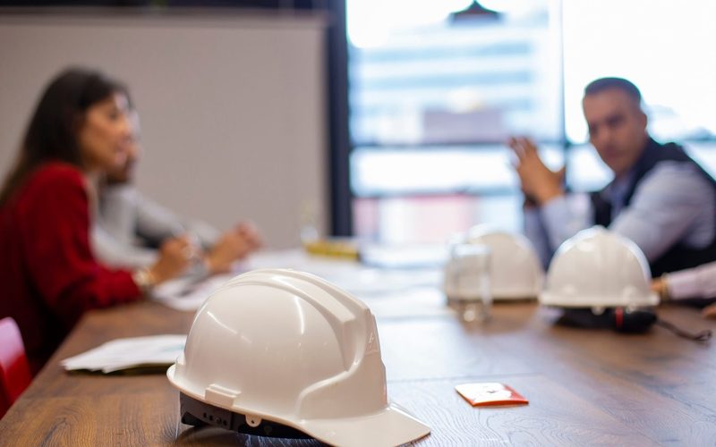 Hard hats on a job meeting table